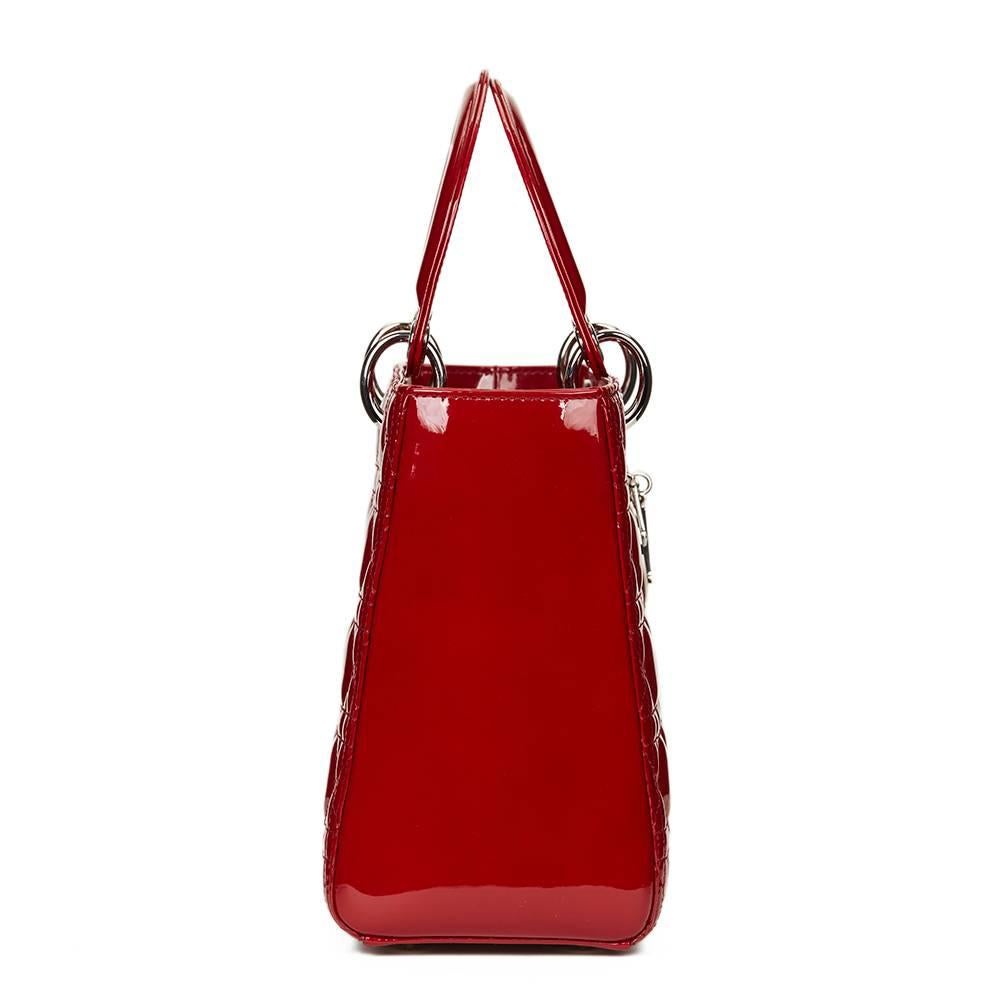 CHRISTIAN DIOR
Deep Red Quilted Patent Leather Medium Lady Dior

This CHRISTIAN DIOR Medium Lady Dior is in Excellent Pre-Owned Condition accompanied by Dior Dust Bag, Authenticity Card, Card Booklet, Shoulder Strap. Circa 2012. Primarily made from