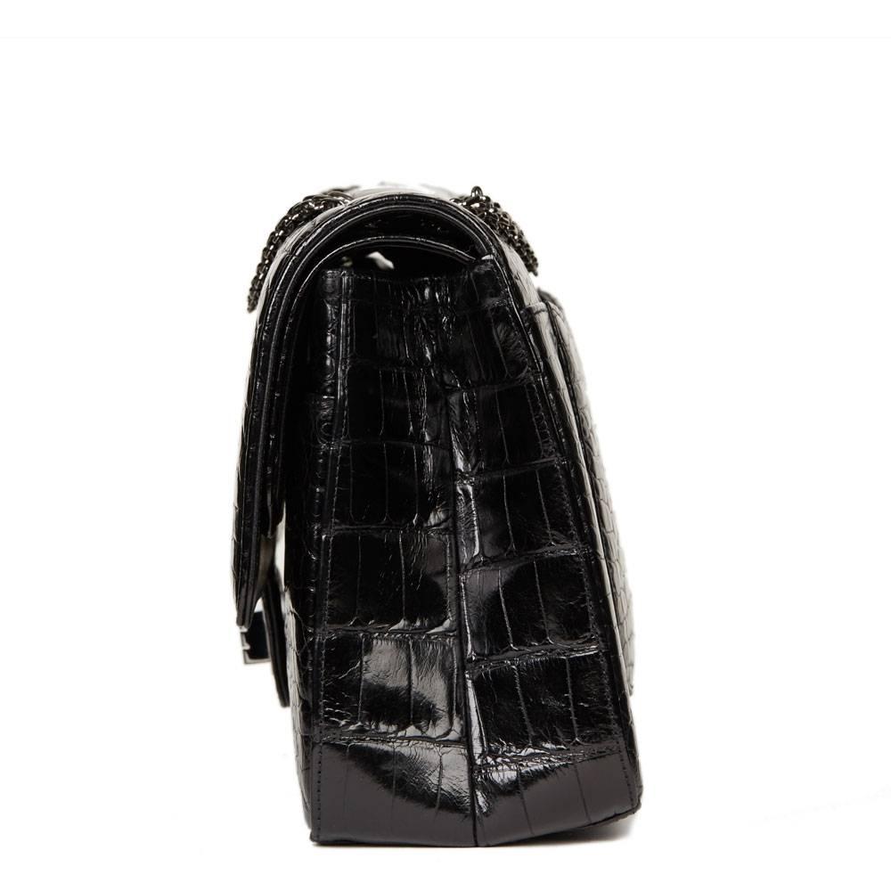 CHANEL
Black Alligator Leather 2.55 Reissue 227 Double Flap Bag

This CHANEL 2.55 Reissue 227 Double Flap Bag is in Excellent Pre-Owned Condition accompanied by Chanel Dust Bag, Box, Authen. Circa 2011. Primarily made from Alligator Leather