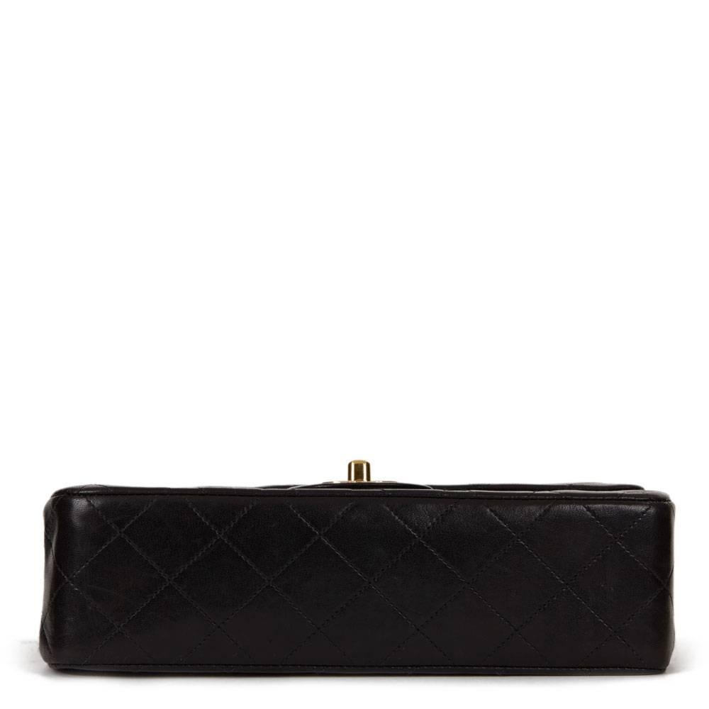 CHANEL
Black Quilted Lambskin Vintage Small Classic Double Flap Bag

This CHANEL Small Classic Double Flap Bag is in Excellent Pre-Owned Condition accompanied by Chanel Dust Bag. Circa 1994. Primarily made from Lambskin Leather complimented by Gold
