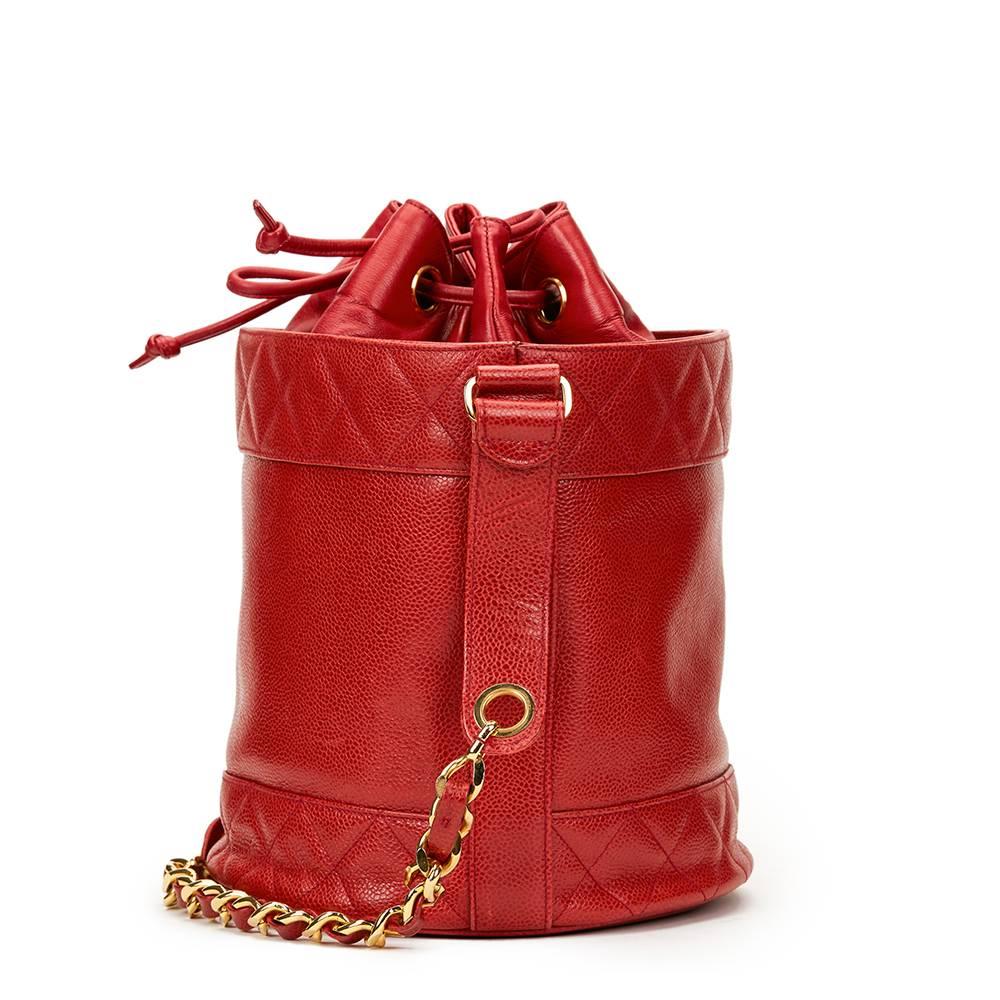 CHANEL
Red Quilted Caviar Leather Vintage Bucket Bag

This CHANEL Bucket Bag is in Excellent Pre-Owned Condition accompanied by Chanel Dust Bag, Interior Pouch. Circa 1990. Primarily made from Caviar Leather, Lambskin Leather complimented by Gold