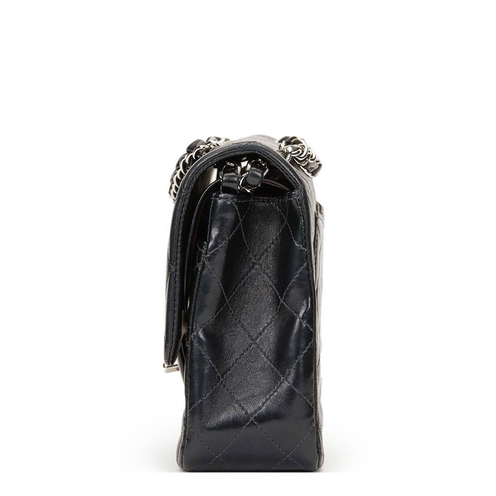 CHANEL
Black Quilted Lambskin Medium Classic Double Flap Bag

This CHANEL Medium Classic Double Flap Bag is in Excellent Pre-Owned Condition. Circa 2004. Primarily made from Lambskin Leather complimented by Silver hardware. Our  reference is HB1236