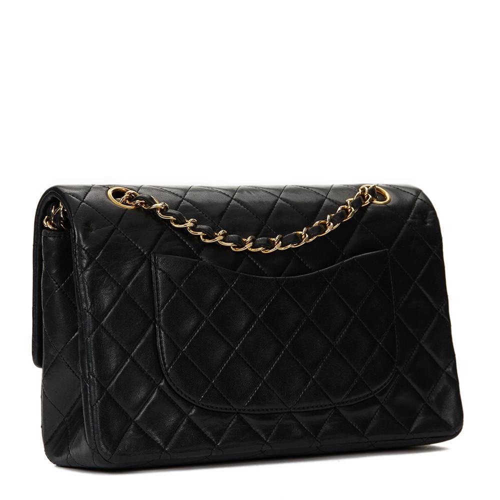 CHANEL
Black Quilted Lambskin Vintage Medium Classic Double Flap Bag

This CHANEL Medium Classic Double Flap Bag is in Very Good Pre-Owned Condition accompanied by Authenticity Card. Circa 1990. Primarily made from Lambskin Leather complimented by