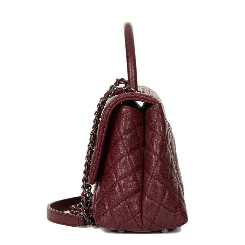 CHANEL
Burgundy Quilted Caviar Leather Medium Coco Handle

 Reference: HB1266
Serial Number: 22204417
Age (Circa): 2016
Accompanied By: Chanel Dust Bag, Box, Authenticity Card, Care Booklet
Authenticity Details: Authenticity Card, Serial Sticker