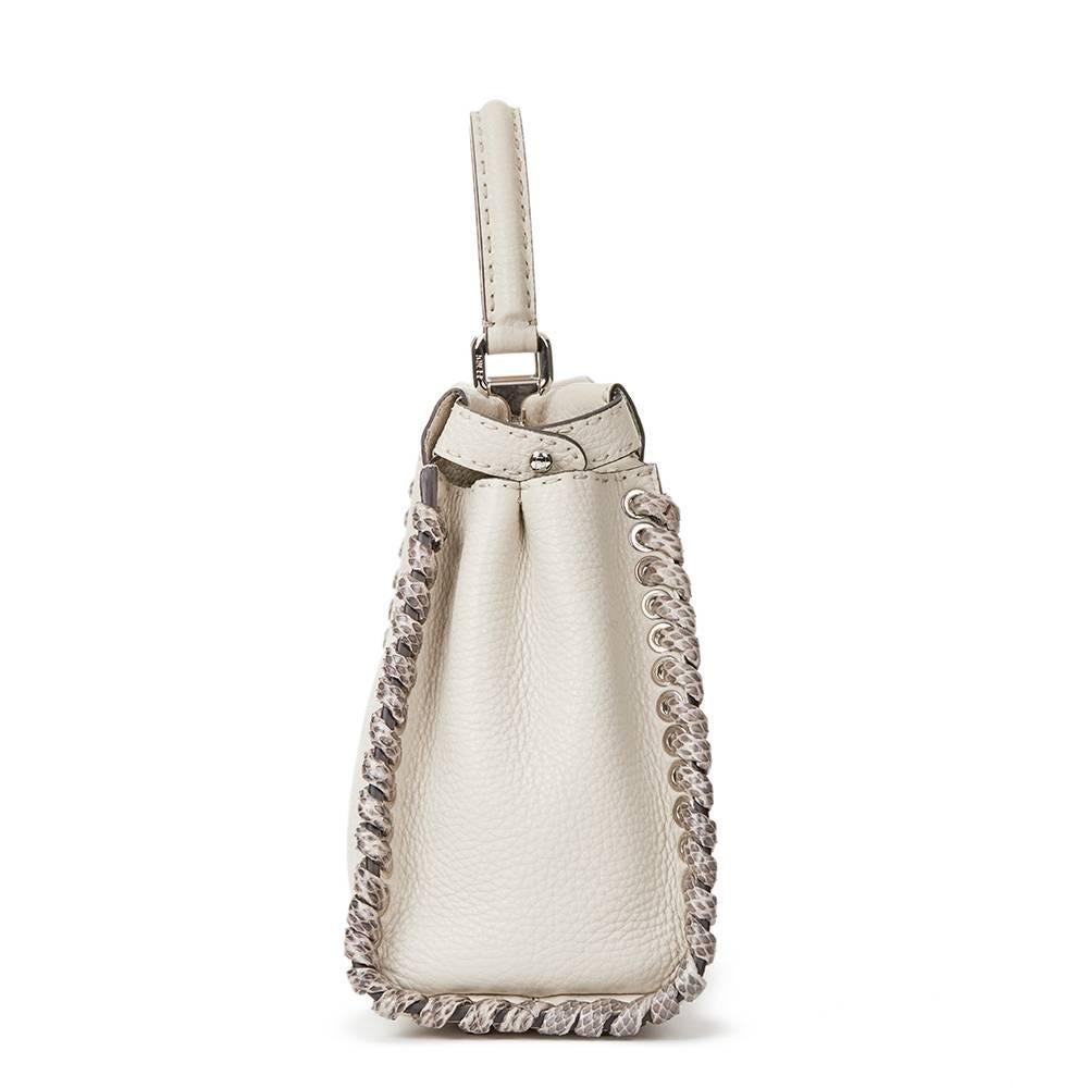 FENDI
Milk-White Roman Calfskin Leather Snakeskin Weave Regular Peekaboo

This FENDI Regular Peekaboo is in Excellent Pre-Owned Condition accompanied by Care Booklet, Shoulder Strap, Rain Cover. Circa 2017. Primarily made from Roman Calfskin