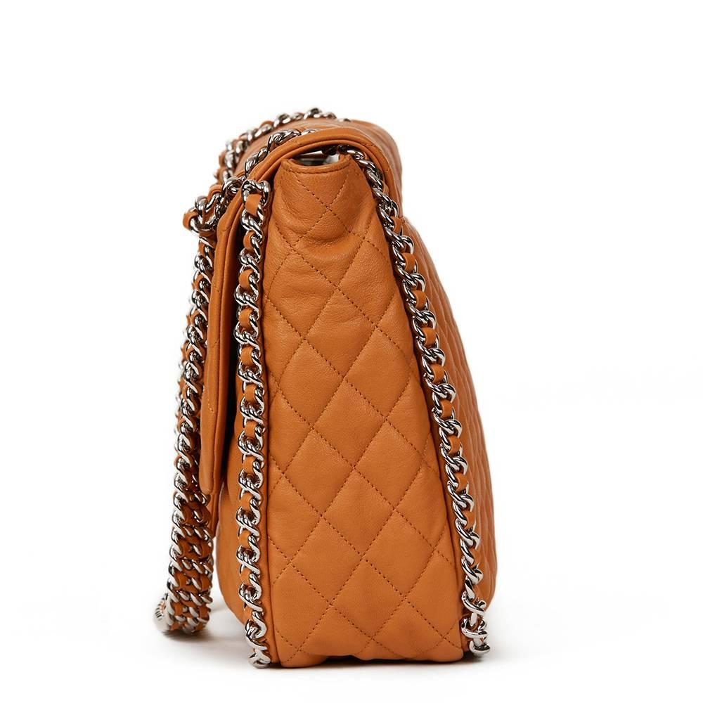 CHANEL
Honey Beige Quilted Calfskin Chain Around Maxi Flap Bag

 Reference: HB1278
Serial Number: 17399144
Age (Circa): 2012
Authenticity Details: Serial Sticker (Made in Italy)
Gender: Ladies
Type: Shoulder

Colour: Honey Beige
Hardware: