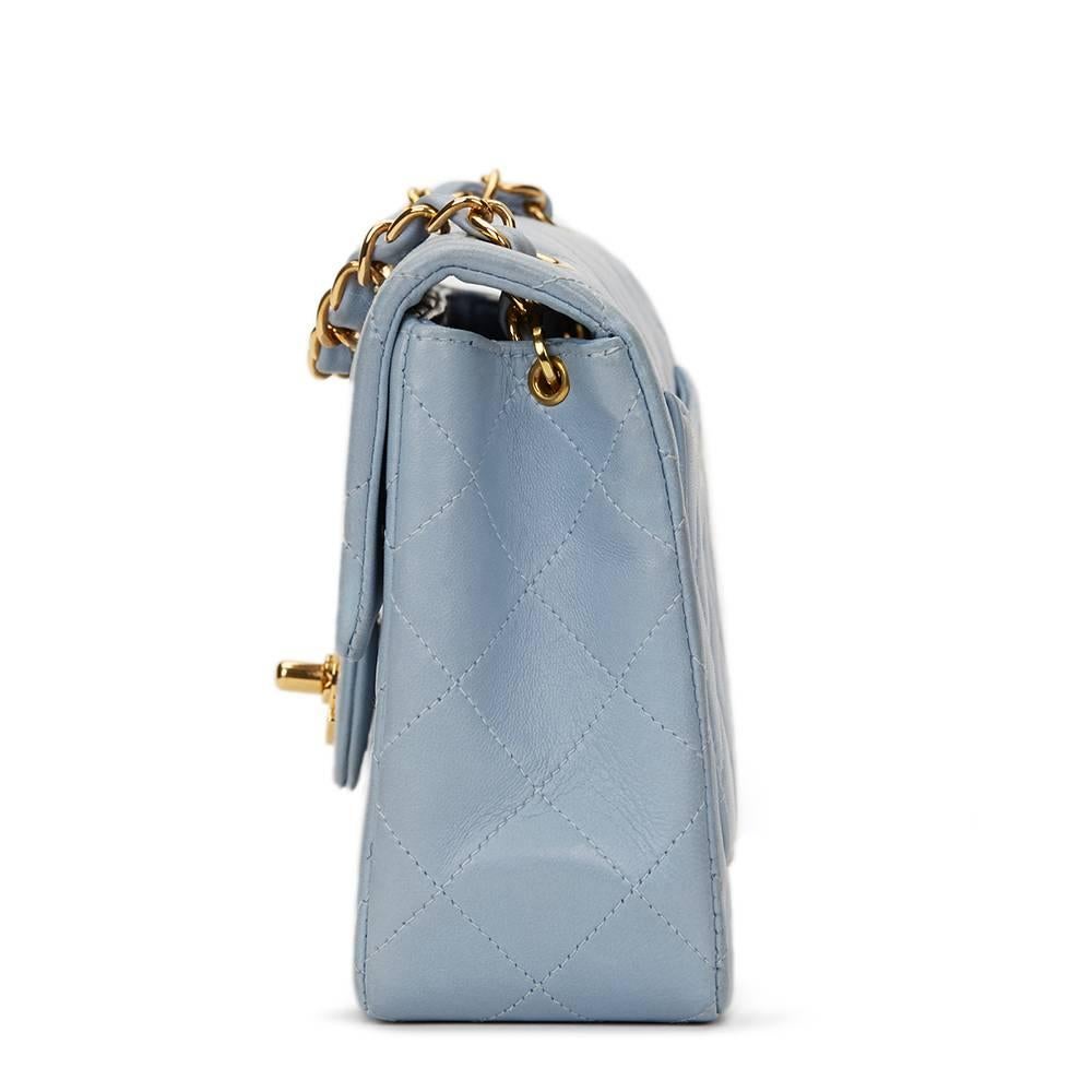 CHANEL
Sky Blue Quilted Lambskin Vintage Mini Flap Bag

This CHANEL Mini Flap Bag is in Excellent Pre-Owned Condition accompanied by Chanel Dust Bag. Circa 1997. Primarily made from Lambskin Leather complimented by Gold (24k Plated) hardware. Our 