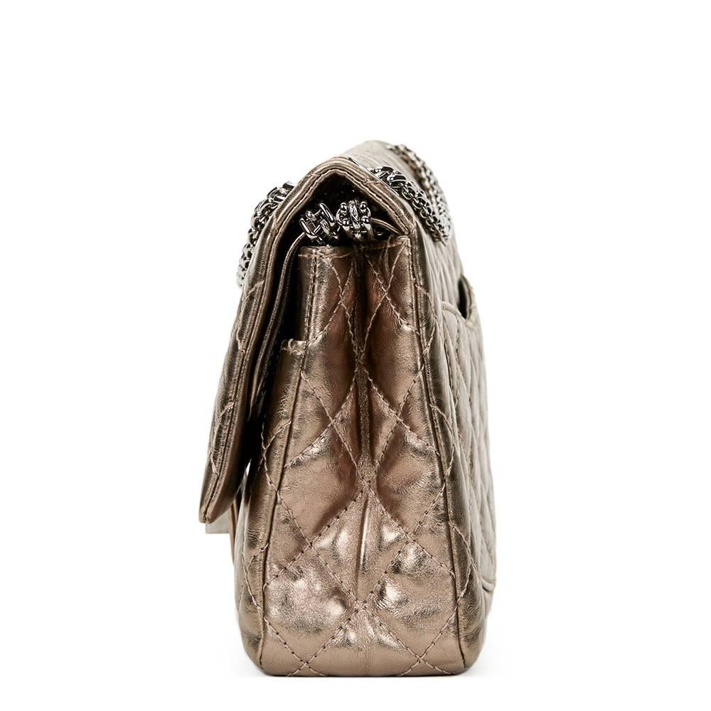 CHANEL
Bronze Quilted Metallic Calfskin Leather 2.55 Reissue 226 Double Flap Bag

This CHANEL 2.55 Reissue 226 Double Flap Bag is in Excellent Pre-Owned Condition. Circa 2006. Primarily made from Metallic Aged Calfskin Leather complimented by Silver