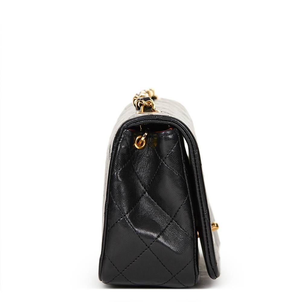CHANEL
Black Quilted Lambskin Vintage Mini Flap Bag

This CHANEL Mini Flap Bag is in Excellent Pre-Owned Condition accompanied by Chanel Dust Bag, Box. Circa 1990. Primarily made from Lambskin Leather complimented by Gold (24k Plated) hardware. Our 