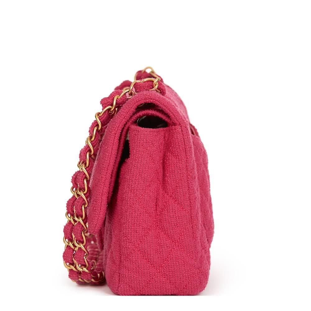 CHANEL
Fuchsia Quilted Bouclé Fabric Medium Classic Double Flap Bag

Reference: HB1314
Serial Number: 13115486
Age (Circa): 2009
Accompanied By: Authenticity Card
Authenticity Details: Authenticity Card, Serial Sticker (Made in Italy)
Gender: