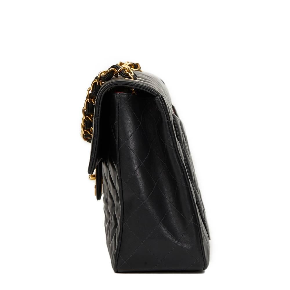 CHANEL
Black Quilted Lambskin Vintage Maxi Jumbo XL Flap Bag

This CHANEL Maxi Jumbo XL Flap Bag is in Excellent Pre-Owned Condition accompanied by Authenticity Card. Circa 1996. Primarily made from Lambskin Leather complimented by Gold (24k Plated)