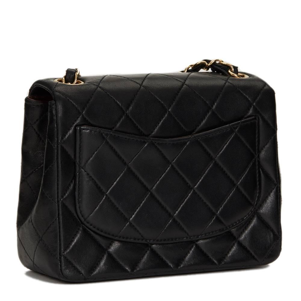"CHANEL
Black Quilted Lambskin Mini Flap Bag

This CHANEL Mini Flap Bag is in Excellent Pre-Owned Condition accompanied by Chanel Dust Bag, Box, Care Booklet. Circa 2004. Primarily made from Lambskin Leather complimented by Gold (24k Plated)
