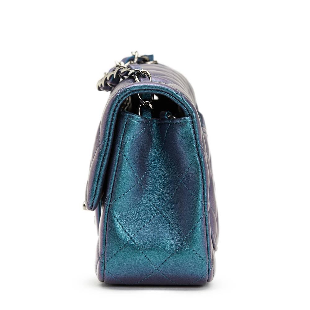CHANEL
Turquoise Metallic Quilted Lambskin Rectangular Mini Flap Bag

This CHANEL Rectangular Mini Flap Bag is in Excellent Pre-Owned Condition accompanied by Chanel Dust Bag, Box, Authenticity Card, Invoice. Circa 2017. Primarily made from Metallic