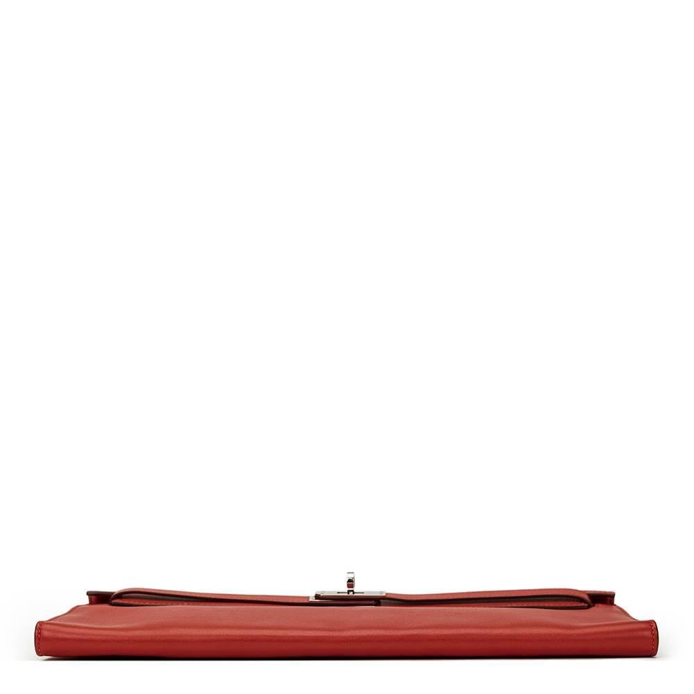 HERMÈS
Rouge Garance Swift Leather Kelly Longue Clutch

This HERMÈS Kelly Longue Clutch is in Very Good Pre-Owned Condition accompanied by Hermès Dust Bag. Circa 2007. Primarily made from Swift Leather complimented by Palladium hardware. Our 