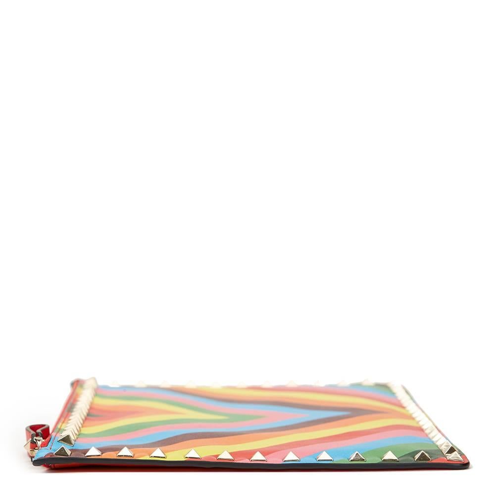 VALENTINO
Rainbow Patterned Lambskin Rockstud Clutch

This VALENTINO Rockstud Clutch is in Excellent Pre-Owned Condition accompanied by Valentino Dust Bag, Care Booklet, Replacement Studs. Circa 2016. Primarily made from Lambskin Leather