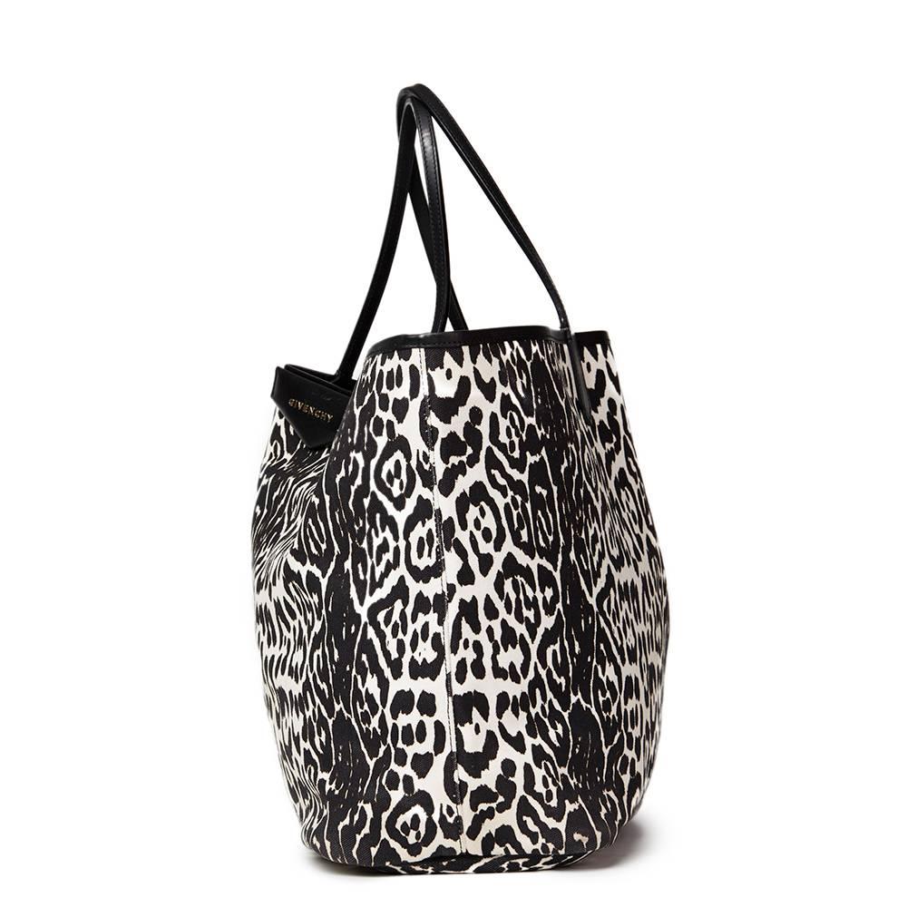 GIVENCHY
Black & White Leopard Print Canvas Large Antigona Tote

This GIVENCHY Large Antigona Tote is in Excellent Pre-Owned Condition accompanied by Givenchy Dust Bag, Removable Pouch. Circa 2011. Primarily made from Canvas, Calfkskin Leather