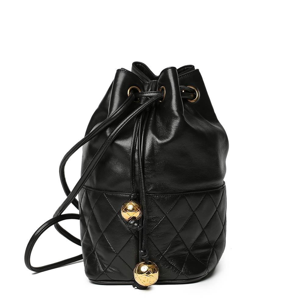 CHANEL
Black Quilted Lambskin Vintage Timeless Bucket Bag

Reference: HB1467
Serial Number: 2449915
Age (Circa): 1991
Accompanied By: Authenticity Card, Interior Pouch
Authenticity Details: Authenticity Card, Serial Sticker (Made in Italy)
Gender: