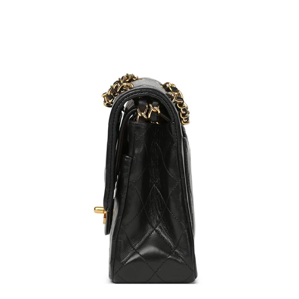 CHANEL
Black Quilted Lambskin Vintage Medium Classic Double Flap Bag

This CHANEL Medium Classic Double Flap Bag is in Very Good Pre-Owned Condition accompanied by Chanel Dust Bag, Box. Circa 1990. Primarily made from Lambskin Leather complimented