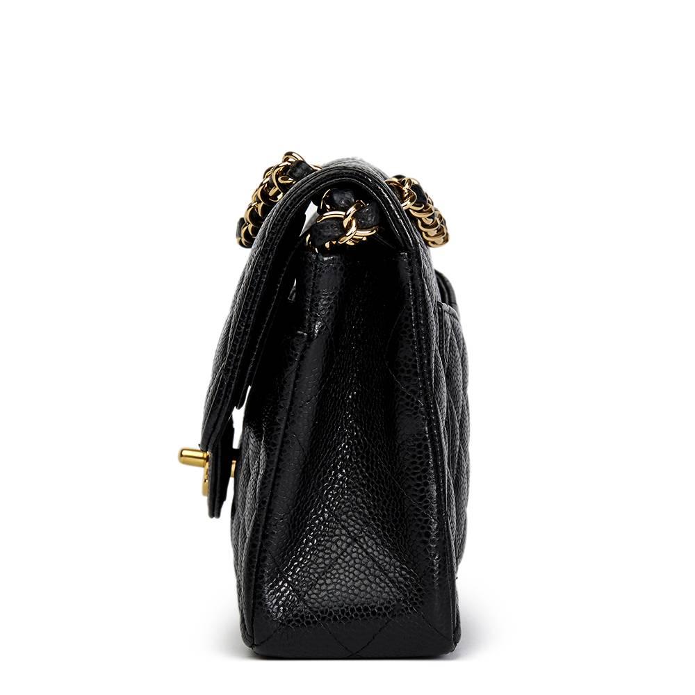 CHANEL
Black Quilted Caviar Leather Small Classic Double Flap Bag

This CHANEL Small Classic Double Flap Bag is in Excellent Pre-Owned Condition accompanied by Chanel Dust Bag, Authenticity Card. Circa 2009. Primarily made from Caviar Leather