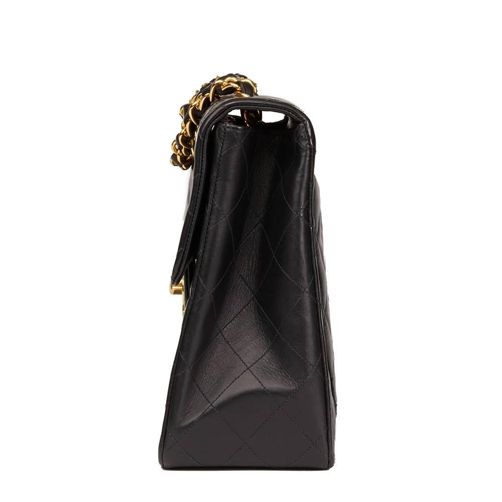 CHANEL
Black Quilted Lambskin Vintage Maxi Jumbo XL Flap Bag

This CHANEL Maxi Jumbo XL Flap Bag is in Excellent Pre-Owned Condition accompanied by Chanel Dust Bag, Authenticity Card, Care Booklet. Circa 1996. Primarily made from Lambskin Leather