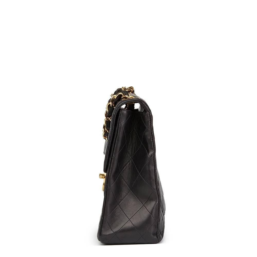 CHANEL
Black Quilted Lambskin Vintage Jumbo XL Flap Bag

This CHANEL Jumbo XL Flap Bag is in Very Good Pre-Owned Condition accompanied by Chanel Dust Bag, Authenticity Card, Care Booklet. Circa 1994. Primarily made from Lambskin Leather complimented