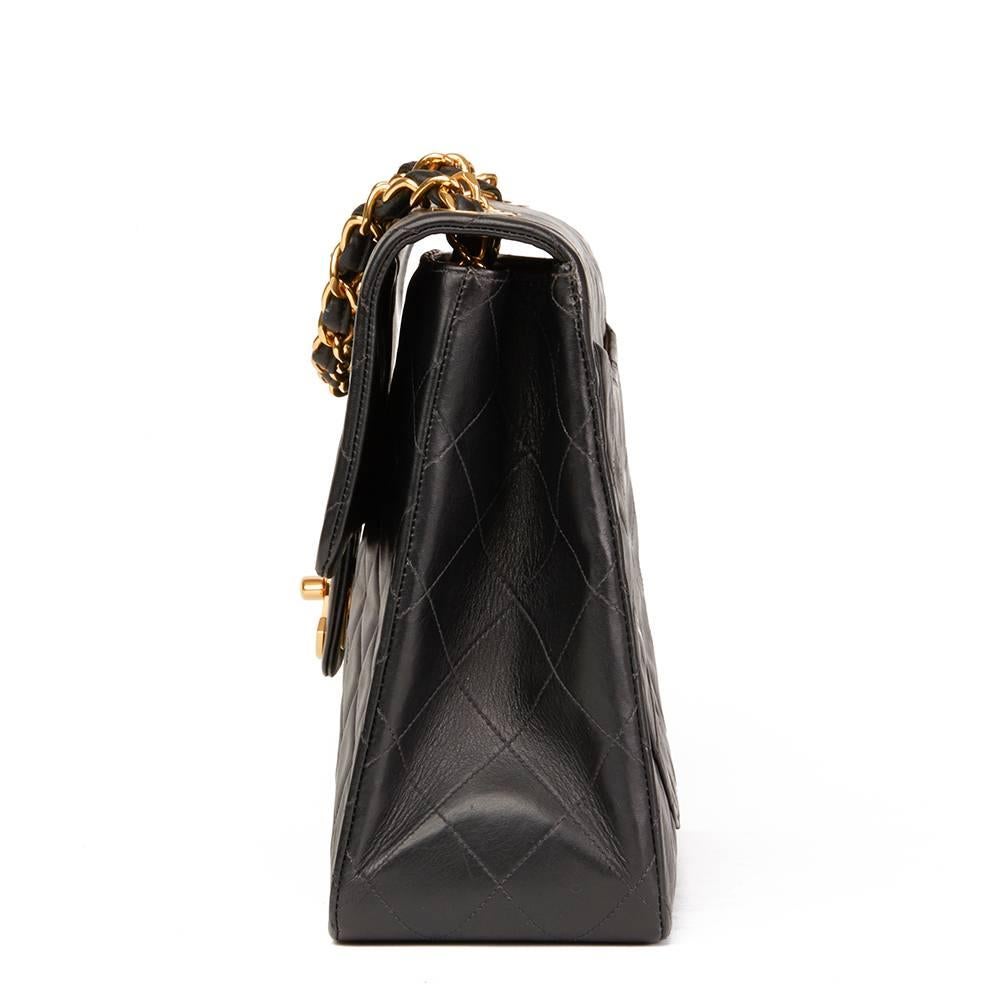 CHANEL
Black Quilted Lambskin Vintage Maxi Jumbo XL Flap Bag

This CHANEL Maxi Jumbo XL Flap Bag is in Excellent Pre-Owned Condition. Circa 1996. Primarily made from Lambskin Leather complimented by Gold (24k Plated) hardware. Our  reference is