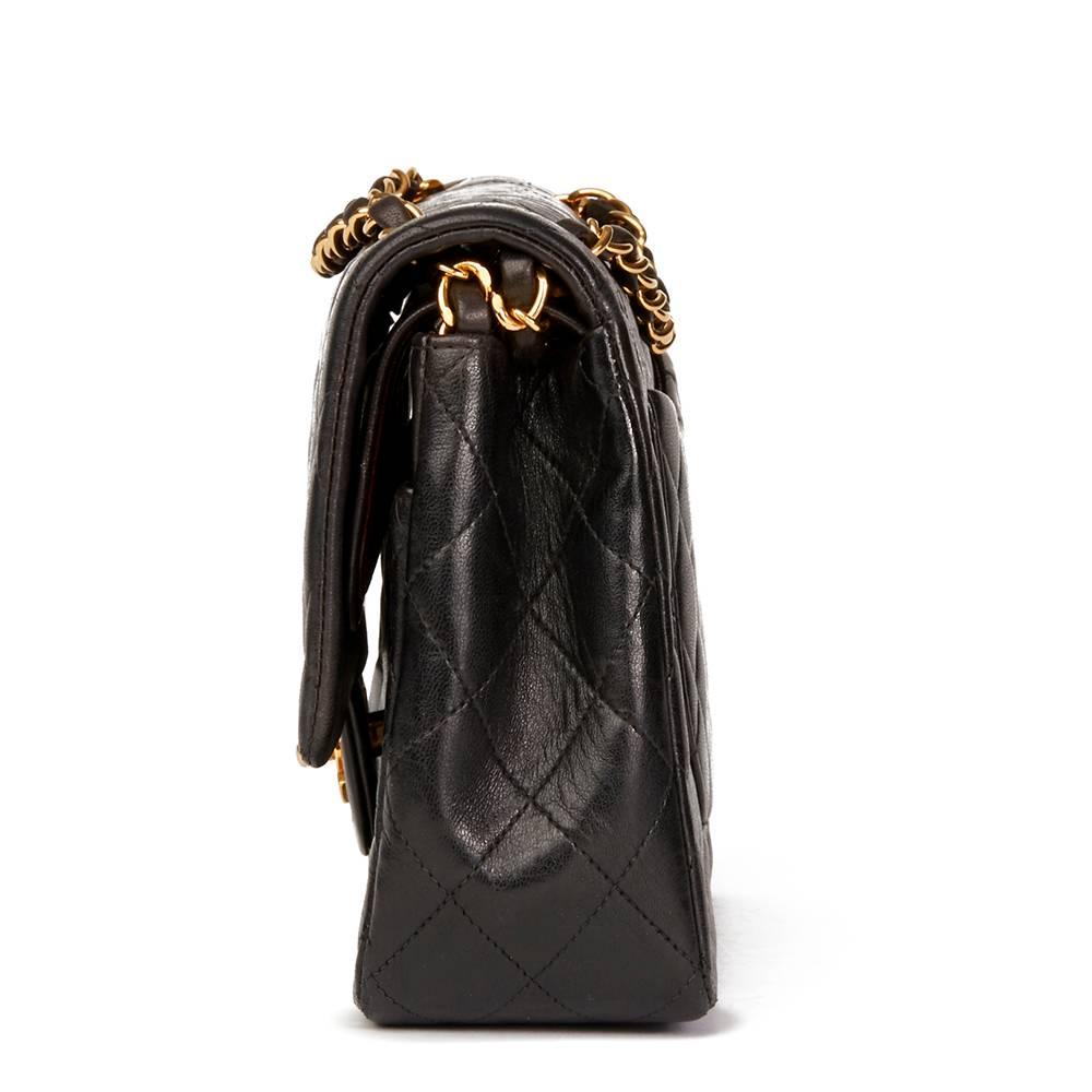 CHANEL
Black Quilted Lambskin Vintage Medium Classic Double Flap Bag

This CHANEL Medium Classic Double Flap Bag is in Very Good Pre-Owned Condition. Circa 1994. Primarily made from Lambskin Leather complimented by Gold (24k Plated) hardware. Our 