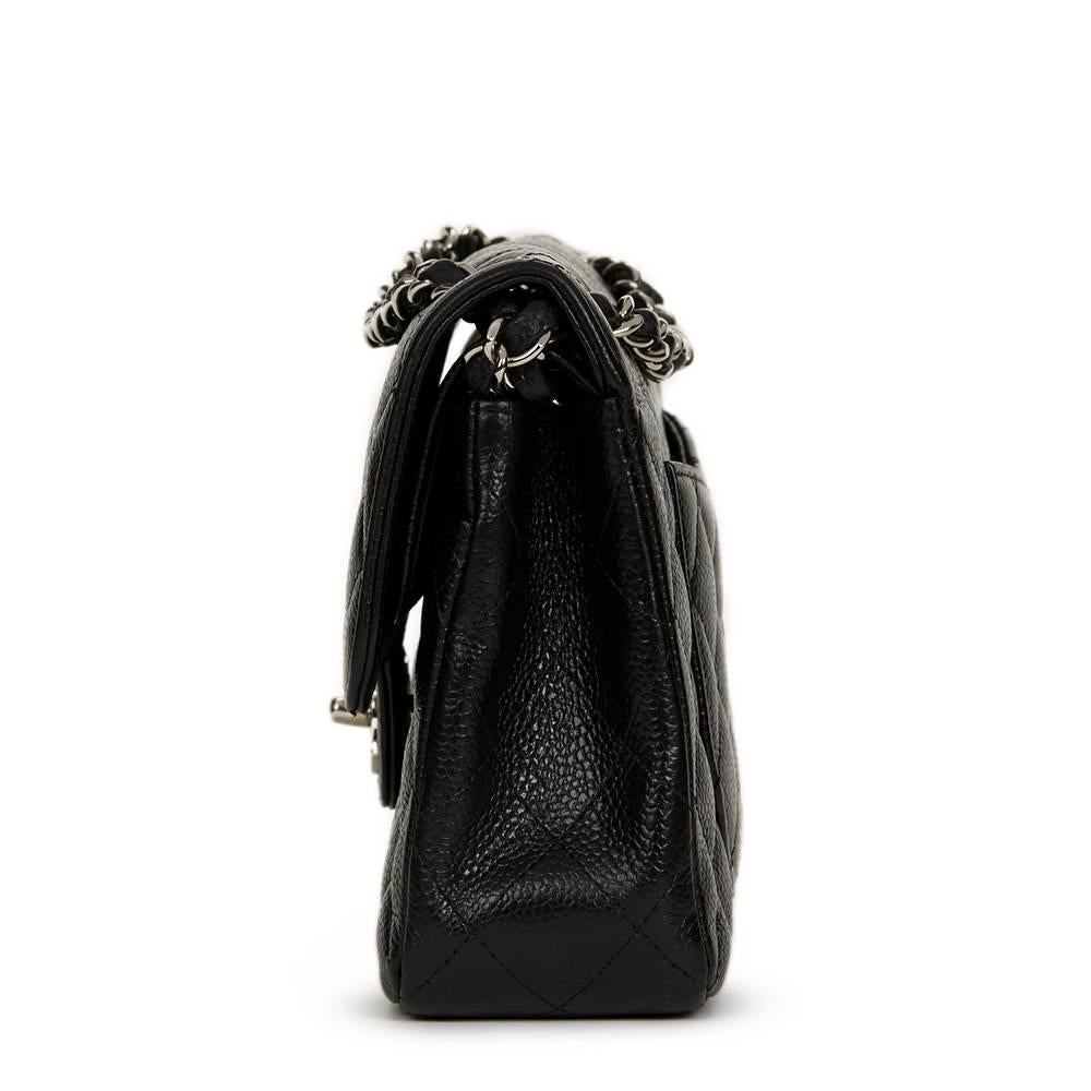 CHANEL
Black Quilted Caviar Leather Small Classic Double Flap

This CHANEL Small Classic Double Flap Bag is in Excellent Pre-Owned Condition accompanied by Care Booklet. Circa 2005. Primarily made from Caviar Leather complimented by Silver hardware.