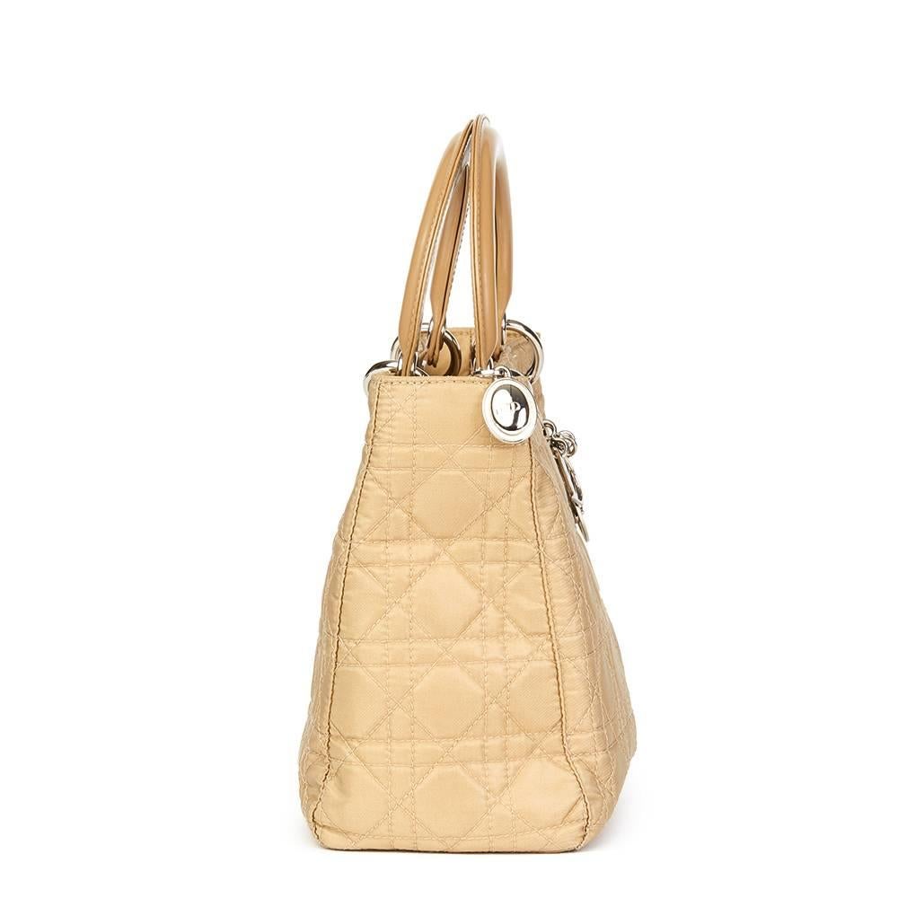 CHRISTIAN DIOR
Beige Quilted Satin & Patent Leather Lady Dior MM

Reference: HB1611
Serial Number: RU0051
Age (Circa): 2001
Accompanied By: Shoulder Strap
Authenticity Details: Date Stamp (Made in Italy)
Gender: Ladies
Type: Shoulder, Top Handle,