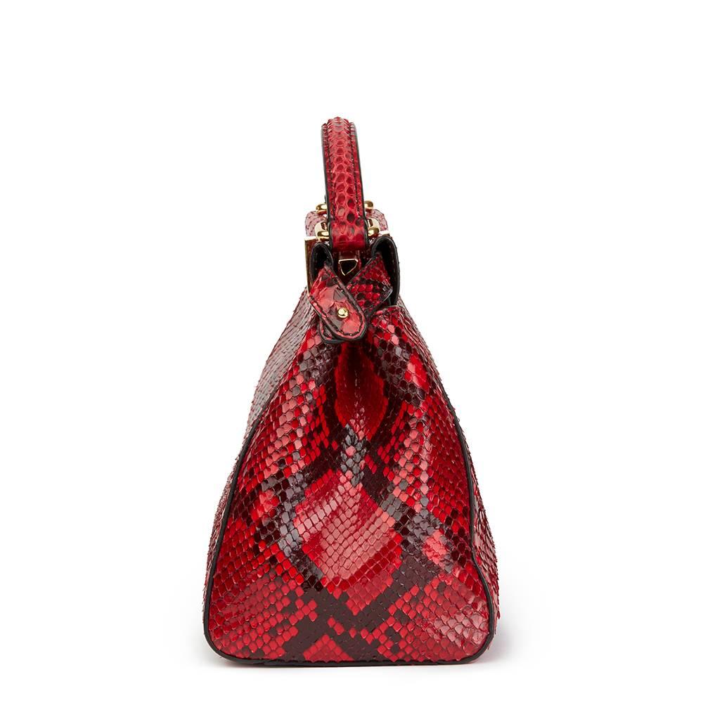 FENDI
Red Python Leather Mini Peekaboo

 Reference: HB1885
Serial Number: 8BN244U7M1688007
Age (Circa): 2017
Accompanied By: Fendi Dust Bag, Shoulder Strap, Rain Cover
Authenticity Details: Serial Tag Made in Italy
Gender: Ladies
Type: Shoulder,