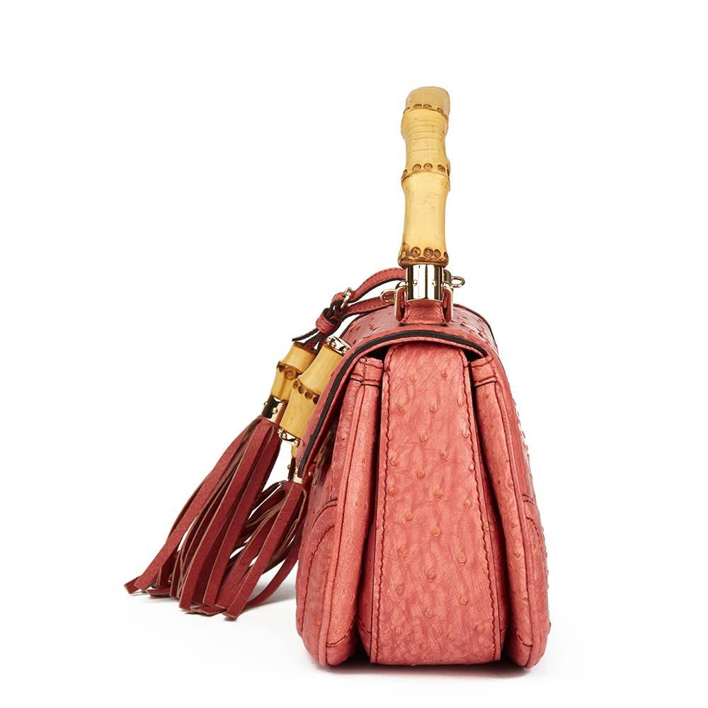 GUCCI
Coral Ostrich Leather Bamboo Classic Top Handle

Reference: HB1900
Serial Number: 254884 218317
Age (Circa): 2011
Accompanied By: Gucci Dust Bag, Mirror, Shoulder Strap, Care Booklet, Leather Swatch, Detachable Tassel Charm
Authenticity