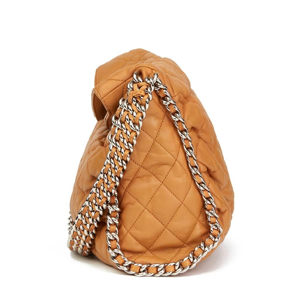 CHANEL
Honey Beige Quilted Washed Lambskin Chain Around Hobo

 Reference: HB1831
Serial Number: 14395017
Age (Circa): 2010
Authenticity Details: Serial Sticker (Made in Italy)
Gender: Ladies
Type: Shoulder

Colour: Honey Beige
Hardware: