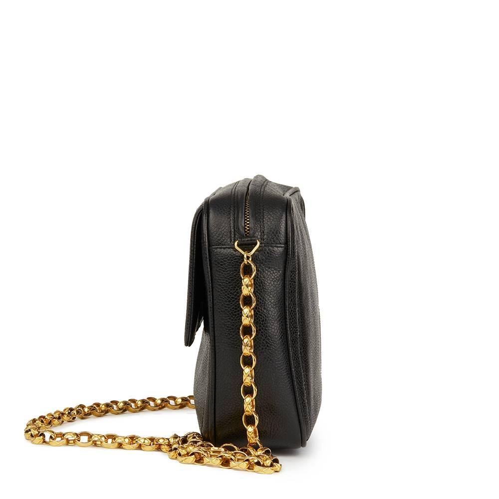 CHANEL
Black Caviar Leather Vintage Timeless Camera Bag

 Reference: HB1925
Serial Number: 2558654
Age (Circa): 1994
Authenticity Details: Serial Sticker (Made in Italy)
Gender: Ladies
Type: Shoulder, Crossbody

Colour: Black
Hardware: