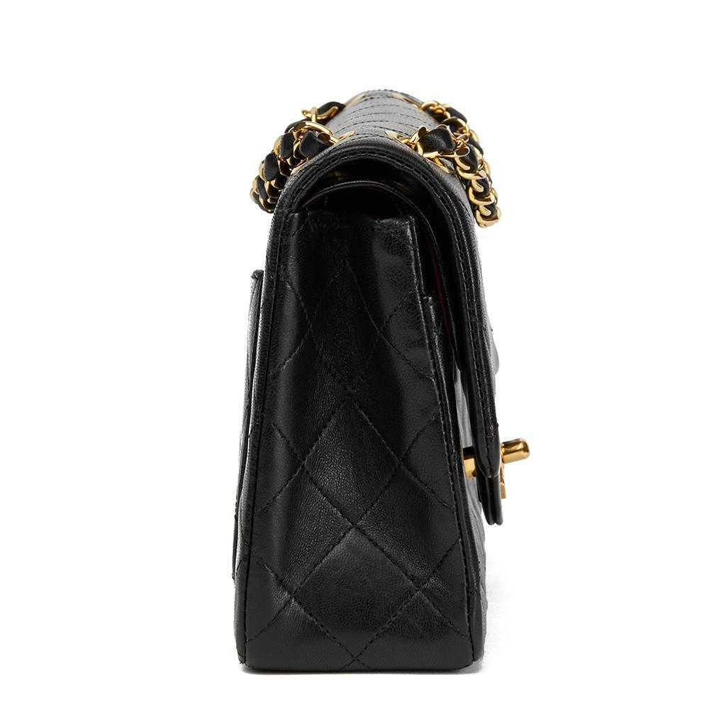 CHANEL
Black Quilted Lambskin Vintage Small Classic Double Flap Bag

 Reference: HB1703
Serial Number: 0635314
Age (Circa): 1986
Accompanied By: Chanel Dust Bag, Box, Care Booklet
Authenticity Details: Serial Sticker (Made in France)
Gender: