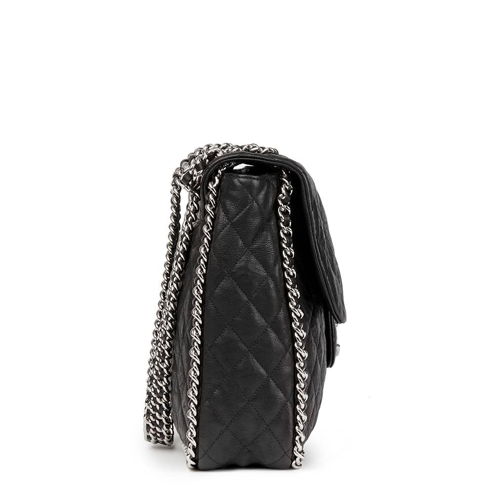 CHANEL
Black Quilted Calfskin Chain Around Maxi Flap Bag

 Reference: HB1730
Serial Number: 19605905
Age (Circa): 2014
Accompanied By: Chanel Dust Bag, Box, Authenticity Card, Care Booklet
Authenticity Details: Authenticity Card, Serial Sticker