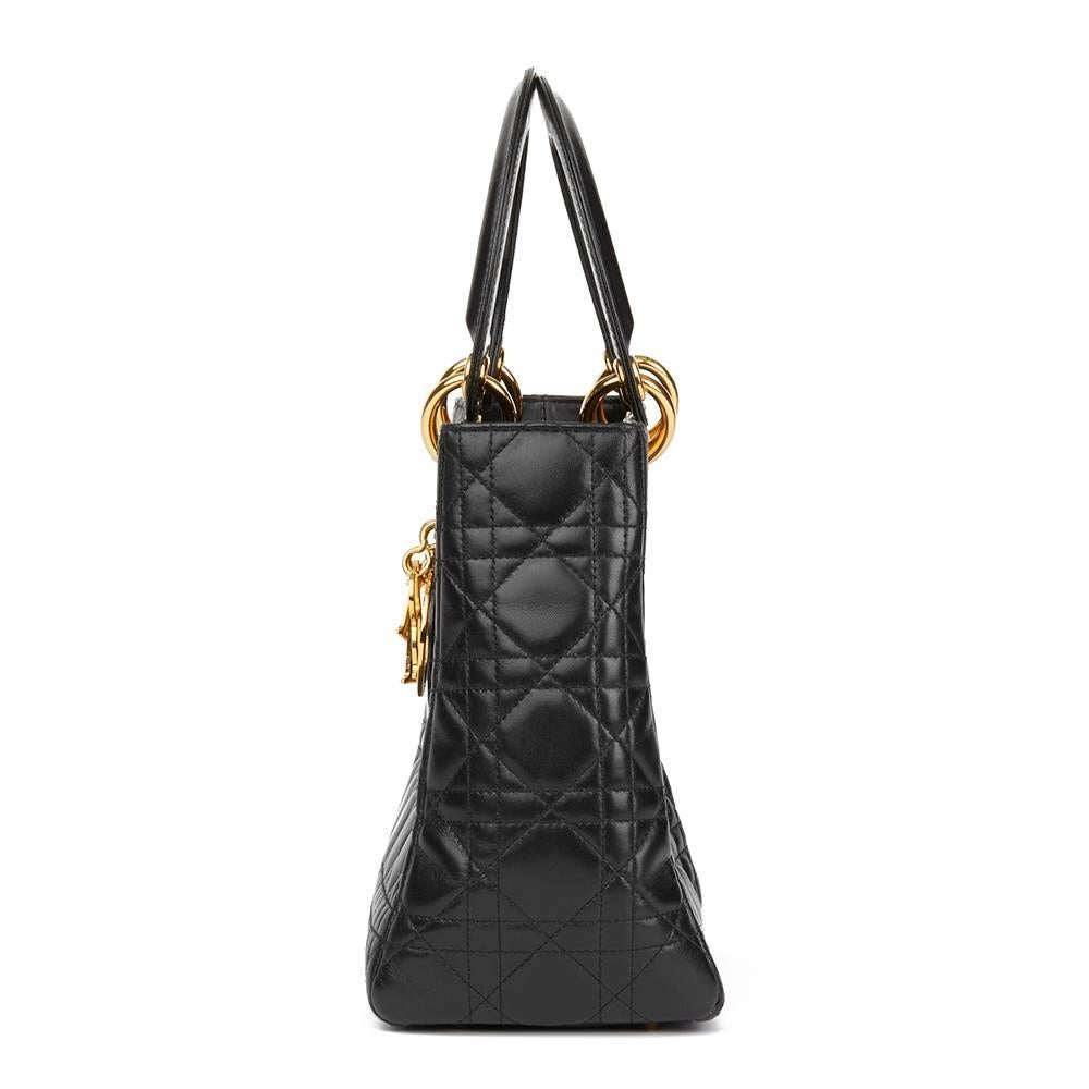 
CHRISTIAN DIOR
Black Quilted Lambskin Lady Dior MM

Reference: HB1759
Serial Number: MA-0033
Age (Circa): 2003
Authenticity Details: Serial Stamp (Made in Italy)
Gender: Ladies
Type: Top Handle

Colour: Black
Hardware: Gold
Material(s): Lambskin