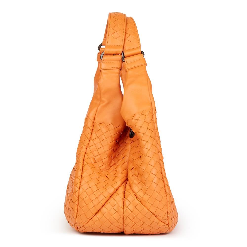 BOTTEGA VENETA
Orange Woven Calfskin Leather Medium Campana Bag

Reference: HB1799
Serial Number: B04302518W
Age (Circa): 2015
Accompanied By: Bottega Veneta Dust Bag, Mirror, Care Booklet
Authenticity Details: Authenticity Tag (Made in