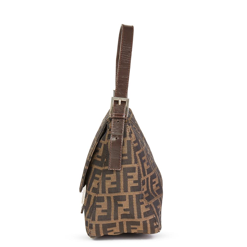 FENDI
Brown Monogram Canvas Mama Baguette

 Reference: HB1979
Serial Number: 2018 26325 008
Age (Circa): 2000
Authenticity Details: Date Stamp (Made in Italy)
Gender: Ladies
Type: Shoulder, Tote

Colour: Brown
Hardware: Silver
Material(s):