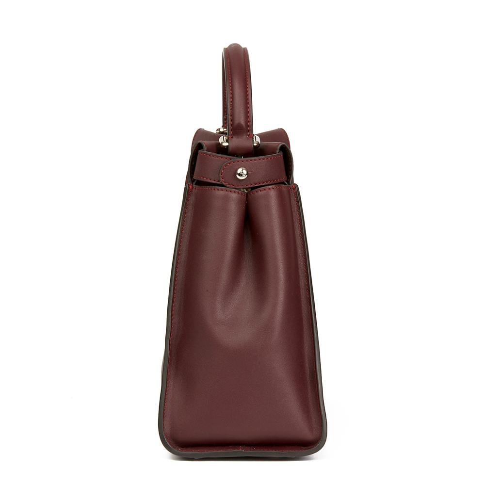 FENDI
Burgundy Calfskin Leather Regular Peekaboo with Flowers

 Reference: HB1992
Serial Number: 8BN2909H31793262
Age (Circa): 2018
Accompanied By: Fendi Dust Bag, Shoulder Strap, Care Booklet, Invoice
Authenticity Details: Serial Stamp (Made in