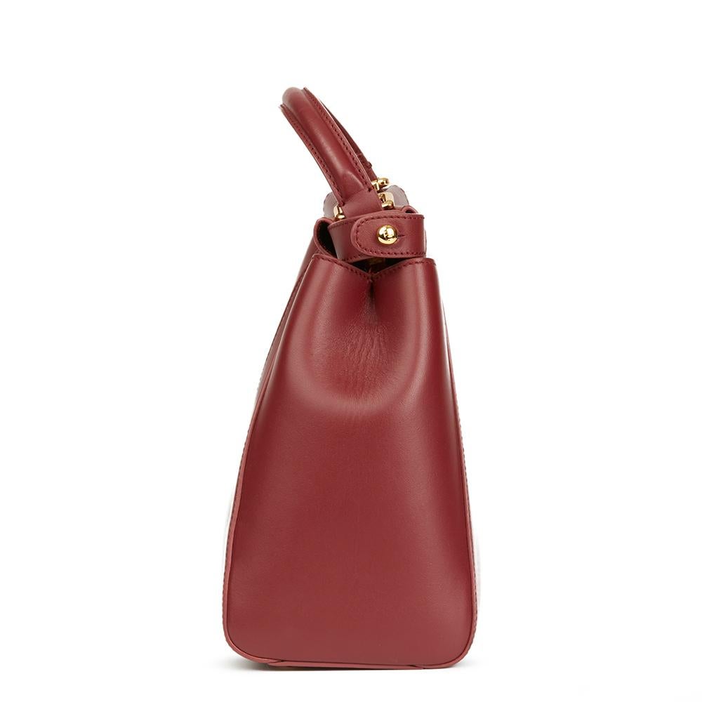 FENDI
Cherry Red Calfskin Leather Regular Peekaboo

 Reference: HB1993
Serial Number: 8BN226K4L1392372
Age (Circa): 2010
Accompanied By: Fendi Dust Bag, Shoulder Strap, Care Tag, Rain Cover
Authenticity Details: Serial Stamp (Made in Italy)
Gender: