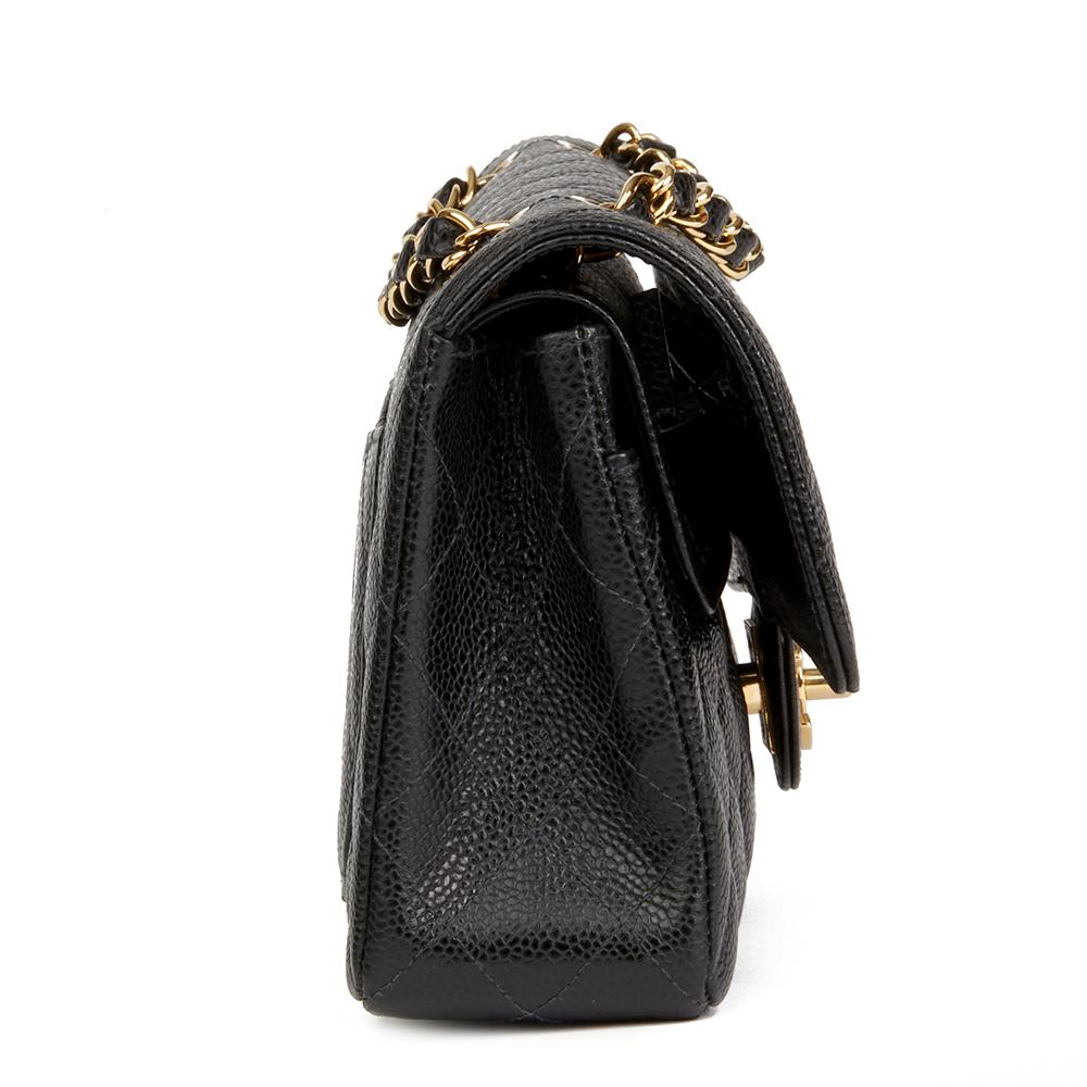 CHANEL
Black Quilted Caviar Leather Small Classic Double Flap Bag

 Reference: HB2110
Serial Number: 8334669
Age (Circa): 2004
Accompanied By: Chanel Dust Bag, Box, Authenticity Card, Care Booklet
Authenticity Details: Serial Sticker, Authenticity