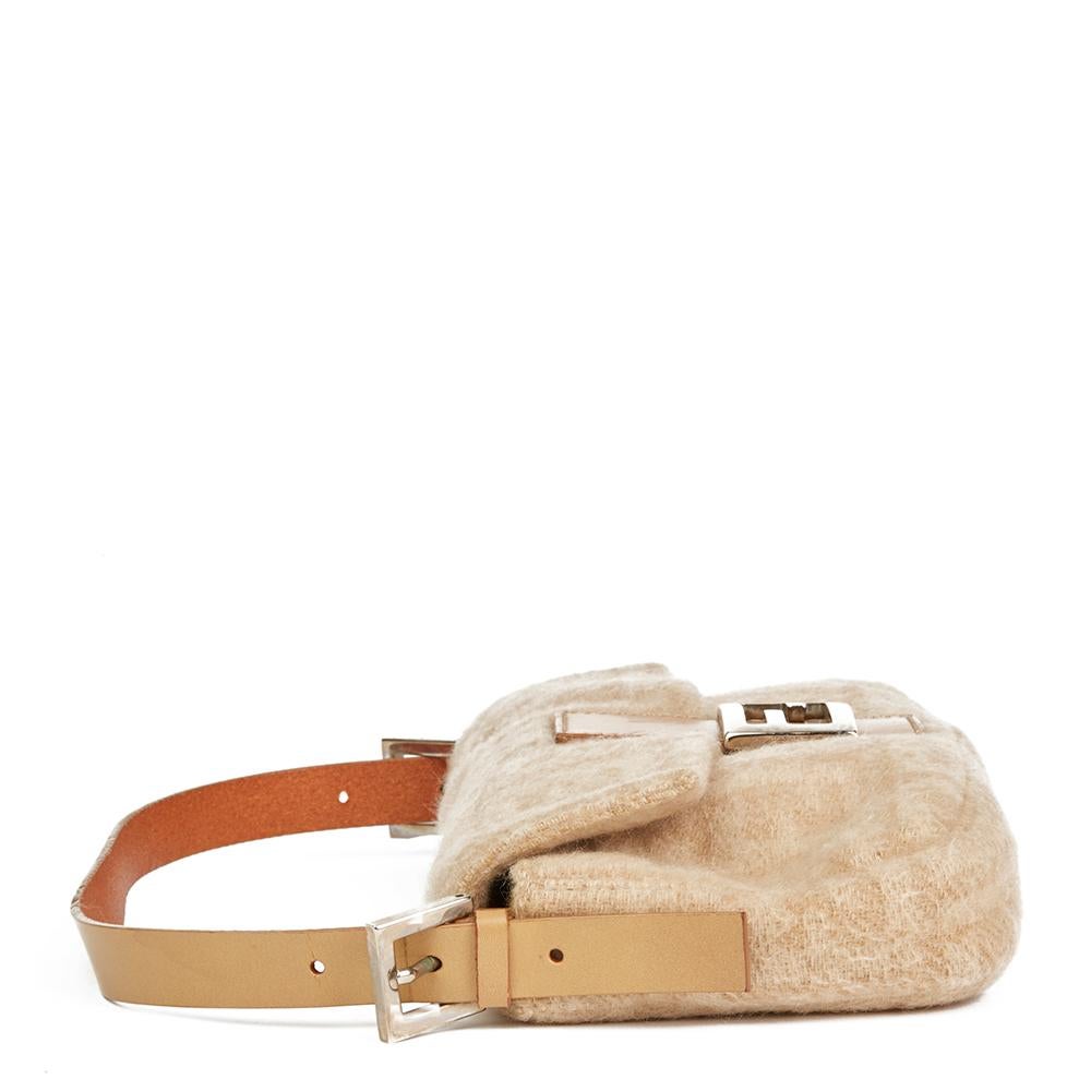 FENDI
Beige Monogram Wool Baguette

 Reference: HB2095
Serial Number: 2321-26424-009
Age (Circa): 2000
Authenticity Details: Serial Stamp (Made in Italy) 
Gender: Ladies
Type: Shoulder

Colour: Beige
Hardware: Silver
Material(s): Wool, Calfskin