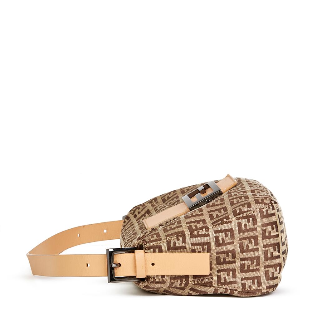 FENDI
Beige Monogram Canvas Baguette 

 Reference: HB2093
Serial Number: 2115-8BR003-028
Age (Circa): 2000
Accompanied By: Fendi Dust Bag
Authenticity Details: Serial Stamp (Made in Italy) 
Gender: Ladies
Type: Shoulder

Colour: Beige
Hardware: