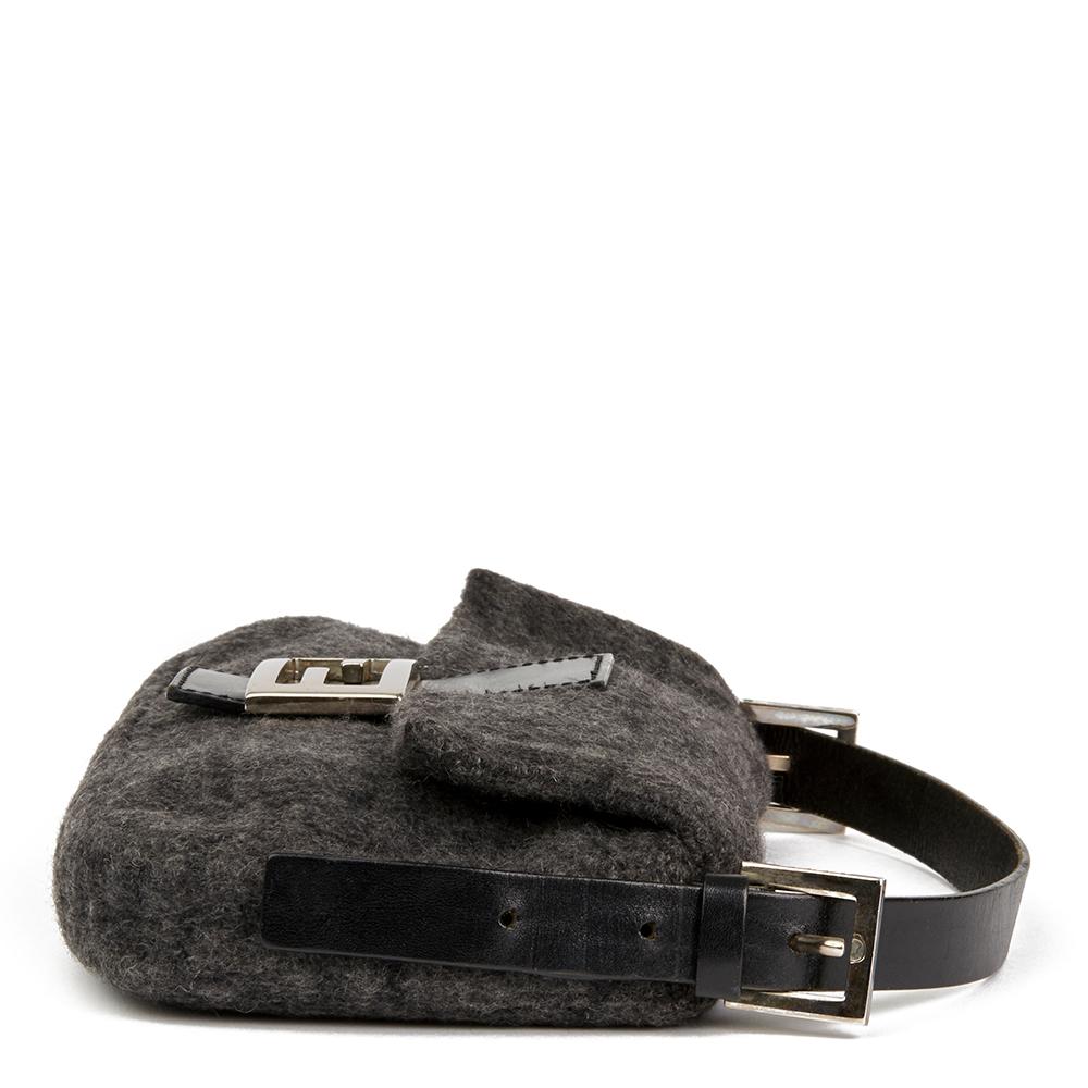 FENDI
Grey Monogram Wool Baguette

 Reference: HB2092
Serial Number: 2308-26424-009
Age (Circa): 2000
Authenticity Details: Serial Stamp (Made in Italy) 
Gender: Ladies
Type: Shoulder

Colour: Grey
Hardware: Silver
Material(s): Wool, Calfskin