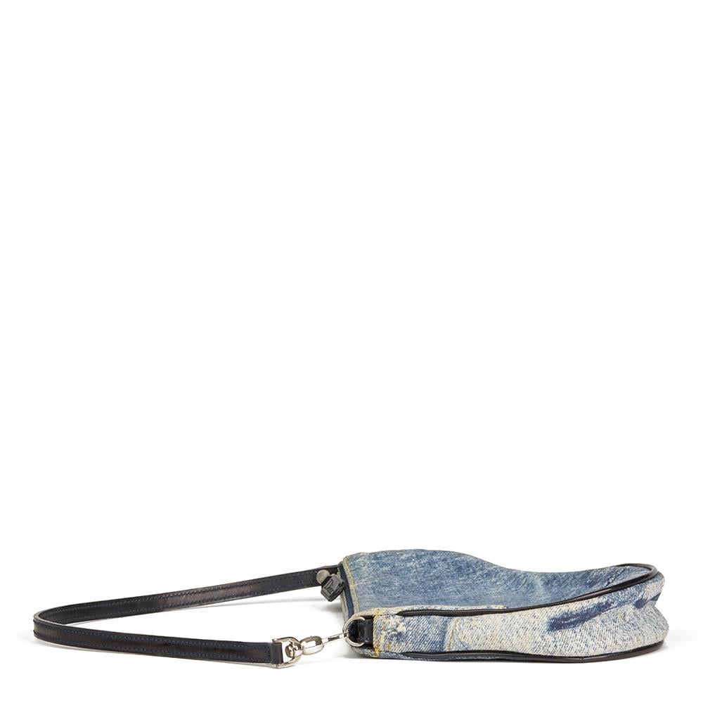 CHRISTIAN DIOR
Blue Patchwork Denim Saddle Pouch 

 Reference: HB2091
Serial Number: BO F 0601
Age (Circa): 2000
Authenticity Details: Date Stamp (Made in Italy) 
Gender: Ladies
Type: Shoulder, Clutch

Colour: Blue
Hardware: Silver
Material(s):