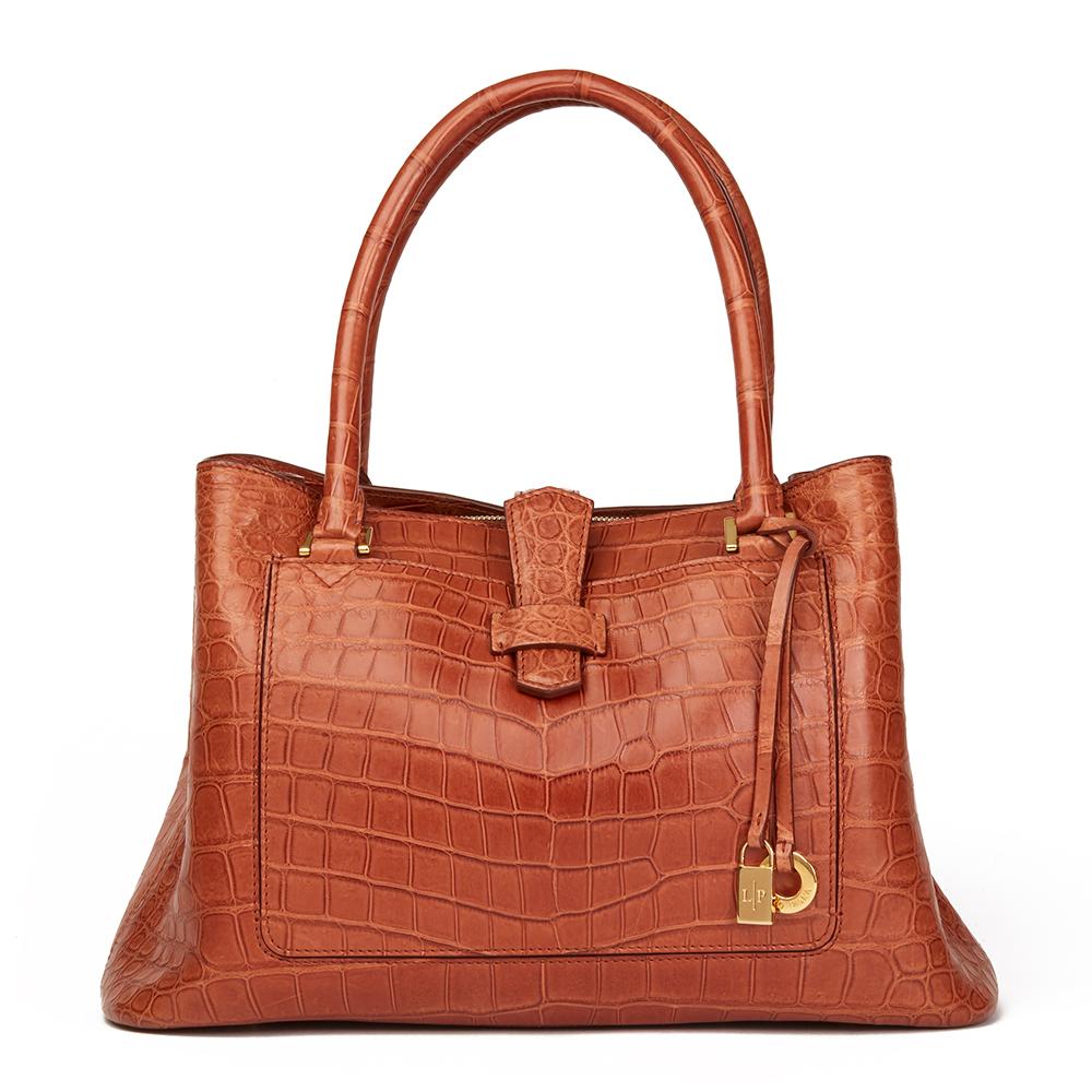 LORO PIANA
Autumn Leaves Matte Crocodile Leather Bellevue Media

 Reference: HB2149
Serial Number: 98493
Age (Circa): 2000
Accompanied By: Loro Piana Dust Bag, Charm, Leather Swatch
Authenticity Details: Serial Number (Made in Italy)
Gender: