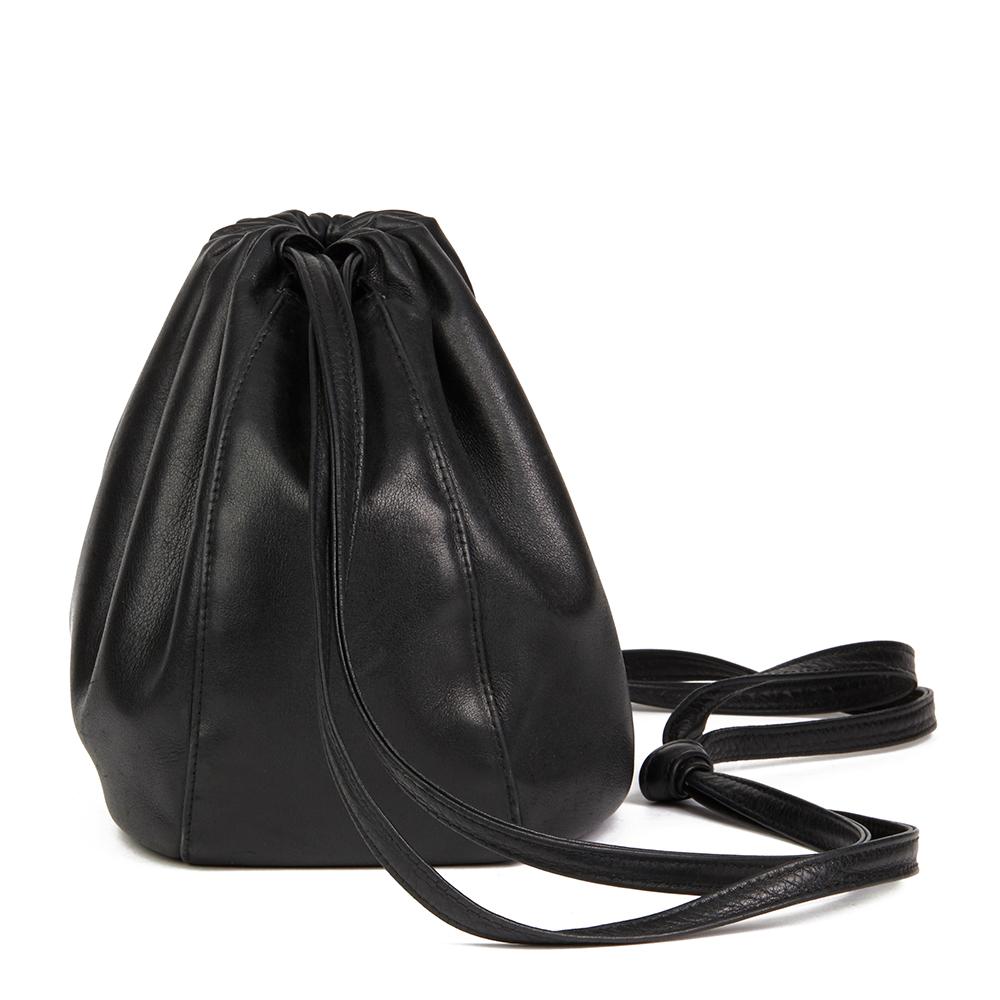 CHANEL
Black Lambskin Vintage Timeless Bucket Bag

Reference: HB2158
Serial Number: 5772627
Age (Circa): 1998
Authenticity Details: Serial Sticker (Made in Italy)
Gender: Ladies
Type: Shoulder, Crossbody 

Colour: Black 
Hardware: Gold
Material(s):