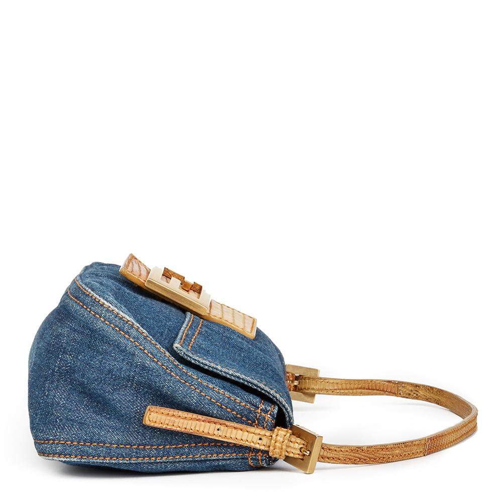 Fendi 
Blue Denim & Beige Lizard Leather Mini Mama Baguette

 Reference: HB2204
Serial Number: 2258-8BR180-038
Age (Circa): 2000
Authenticity Details: Serial Stamp (Made in Italy)
Gender: Ladies
Type: Top Handle, Shoulder

Colour: Blue
Hardware: