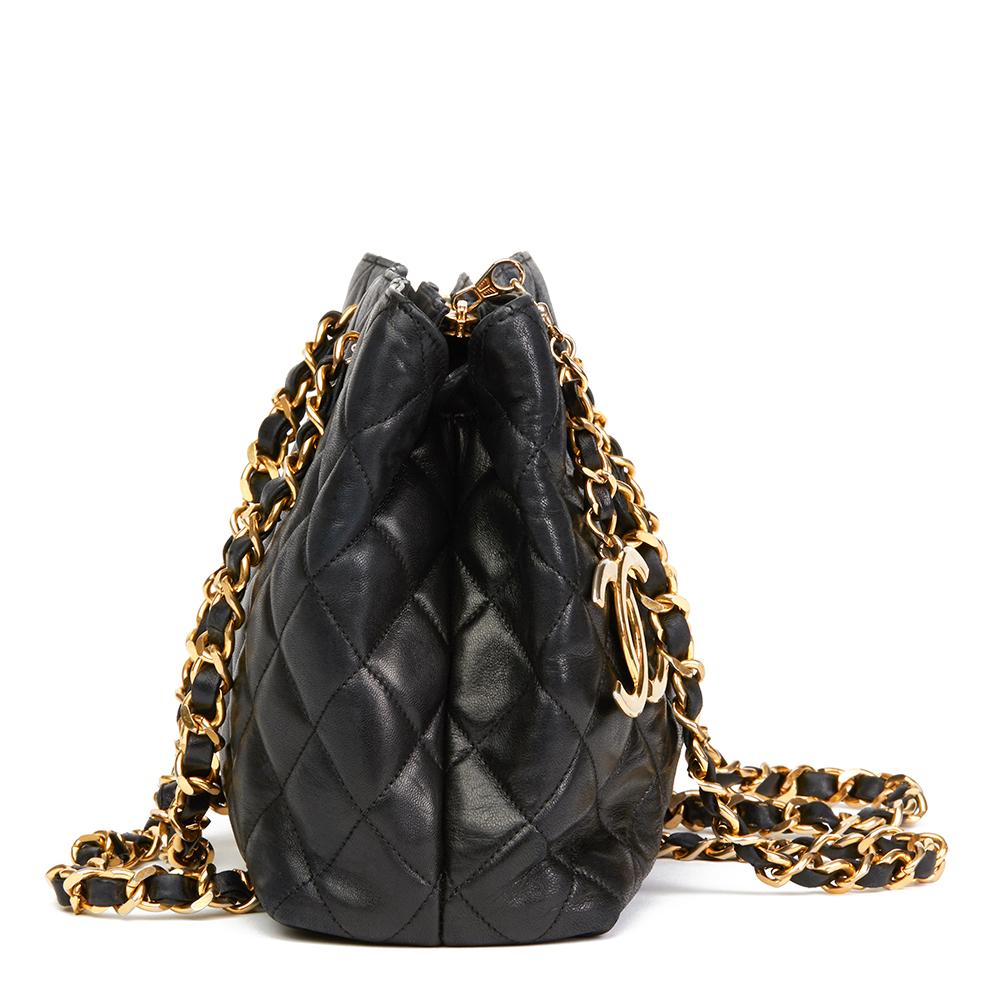 Chanel 
Black Quilted Lambskin XL Timeless Charm Shoulder Bag

Reference: HB2201
Serial Number: 1341702
Age (Circa): 1989
Accompanied By: Chanel Dust Bag
Authenticity Details: Serial Sticker (Made in Italy)
Gender: Ladies
Type: Shoulder

Colour: