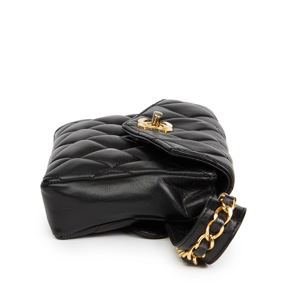 CHANEL
Black Quilted Lambskin Vintage Classic Belt Bag

 Reference: HB2181
Age (Circa): 1990
Authenticity Details: (Made in Italy)
Gender: Ladies
Type: Belt Bag

Colour: Black
Hardware: Gold (24k Plated)
Material(s): Lambskin Leather
Interior: Black