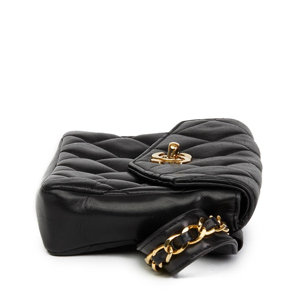 CHANEL
Black Quilted Lambskin Vintage Classic Belt Bag

 Reference: HB2180
Age (Circa): 1990
Accompanied By:  ✖
Authenticity Details: (Made in Italy)
Gender: Ladies
Type: Belt Bag

Colour: Black
Hardware: Gold (24k Plated)
Material(s): Lambskin